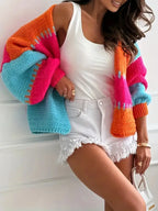 Candy Cloud Cardigan ¨C oversized color block knit in orange, pink, blue, and contrasting tones.