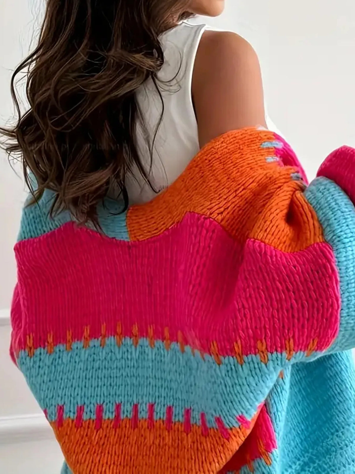 Candy Cloud Cardigan ¨C oversized color block knit in orange, pink, blue, and contrasting tones.
