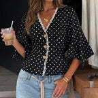 Blouse noire à pois blancs et manches à volants SecretBombe